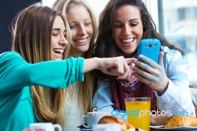 Friends Having Fun With Smartphones Stock Photo