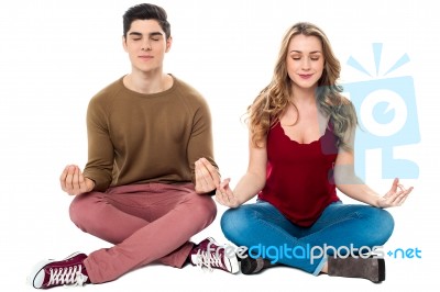 Friends Meditating In Lotus Pose, Peace Of Mind Stock Photo