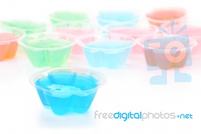 Front Blue Jelly Cup On White Floor Stock Photo