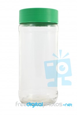 Front Of Glass Bottle With Plastic Cover On White Background Stock Photo