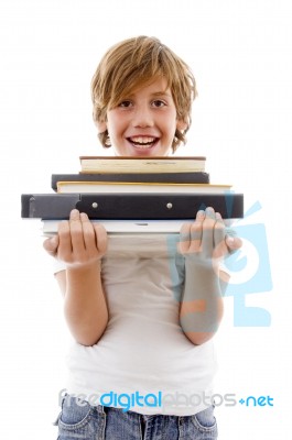 Front View Of Boy Holding Books Stock Photo