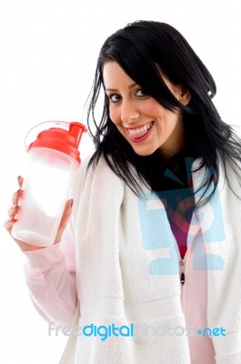 Front View Of Happy Female With Bottle On White Background Stock Photo