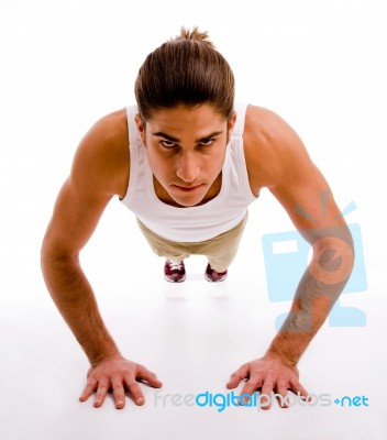 Front View Of Man Doing Pushups Stock Photo