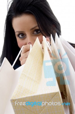 Front View Of Model Showing Shopping Bags Stock Photo