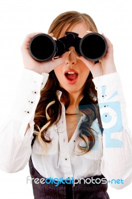 Front View Of Shocked Model Looking Through Binocular Stock Photo