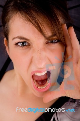 Front View Of Shouting Young Woman Stock Photo