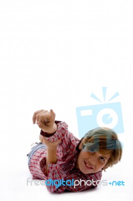 Front View Of Smiling Child Pointing Stock Photo