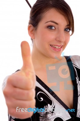 Front View Of Smiling Japanese Woman Showing Thumbs Up Stock Photo