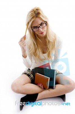 Front View Of Smiling Young Student Holding Books Stock Photo