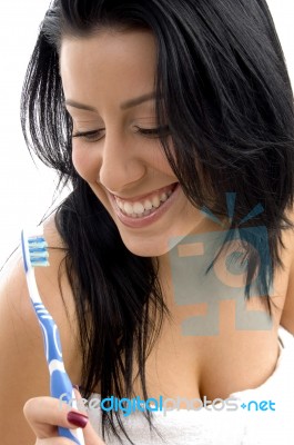 Front View Of Woman Holding Toothbrush Stock Photo