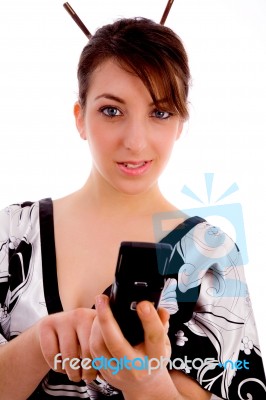 Front View Of Woman In Kimono Dialing Number Stock Photo