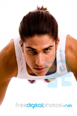 Front View Of Young Man Doing Pushups Stock Photo