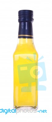 Front Yellow Glass Liquor Bottle On White Background Stock Photo