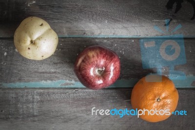 Fruit Arranged On Old Wooden Stock Photo