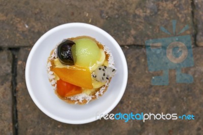 Fruit Tart On Brick Floor Stock Photo