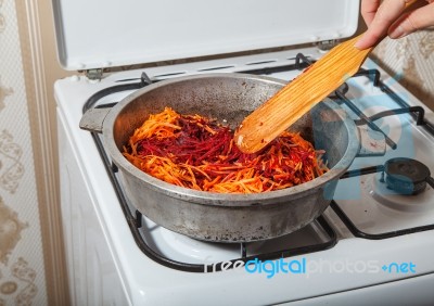 Frying In A Pan Carrots And Beets Stock Photo