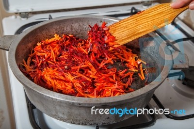 Frying In A Pan Carrots And Beets Stock Photo