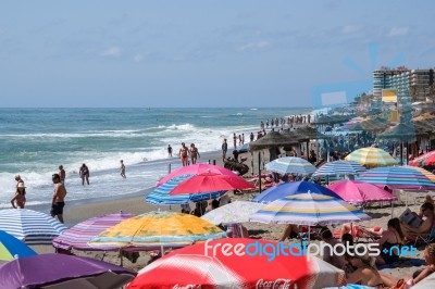 Fuengirola, Andalucia/spain - July 4 : People Enjoying The Beach… Stock Photo