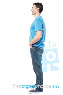 Full Length Of Casual Man Posing Side Ways Stock Photo