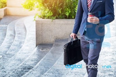 Full Length Picture Of A Young Business Man Walking Forward With… Stock Photo