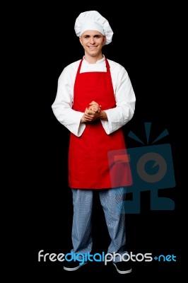 Full Length Portrait Of A Handsome Chef Stock Photo