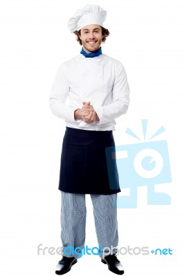 Full Length Portrait Of A Handsome Chef Stock Photo