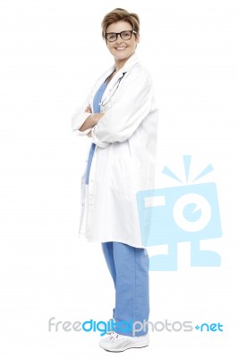 Full Length Portrait Of A Smiling Female Doctor Stock Photo