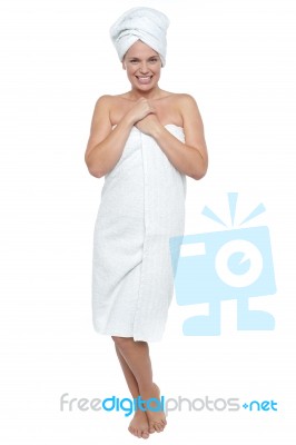 Full Length Portrait Of A Woman Wrapped In Towel Stock Photo