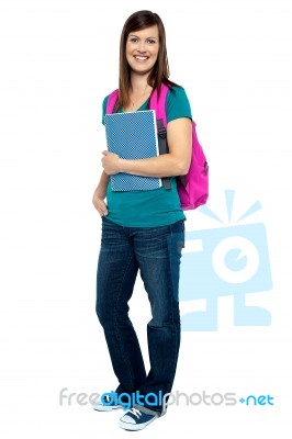 Full Length Portrait Of Pretty College Girl Stock Photo