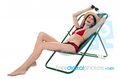 Full Length Portrait Of Relaxed Cheerful Bikini Woman Stock Photo