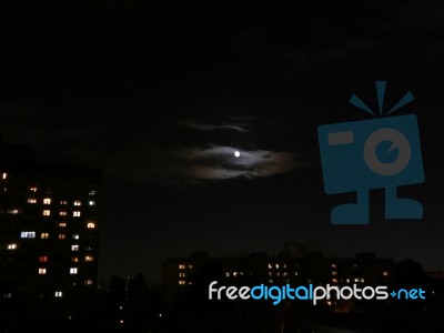 Full Moon At Night In The City Shining Bright  Stock Photo