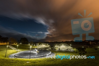 Full Moon Night Among Clouds From The Town Of Ribadeo, Spain Stock Photo