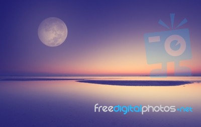 Full Moon Over Beach Sunset Stock Photo