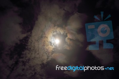 Full Moon Shining Glowing Light Through The Darkness Of Cloudy N… Stock Photo