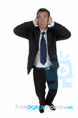 Full Pose Of Businessman Putting Hands On His Ears Stock Photo