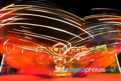 Funfair Ride With Neon Light Stock Photo