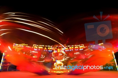 Funfair Ride With Neon Light Stock Photo