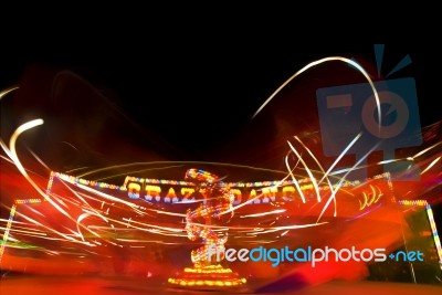 Funfair Ride With Neon Light Stock Photo