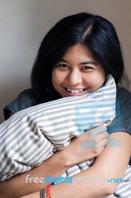 Funny Woman Holding Pillow Stock Photo