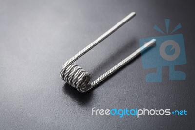Fused Clapton Coil For Vaping On A Black Background Stock Photo