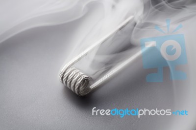 Fused Clapton Coil For Vaping On A Black Background Smoke Stock Photo