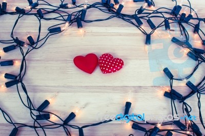 Garland Lights With Red Hearts Shape On Wooden Background Stock Photo