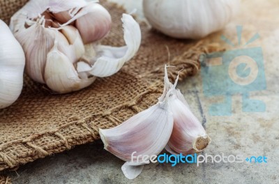 Garlic Cloves On Table Stock Photo