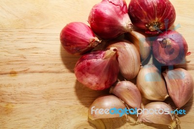 Garlic On Chopping Block Stock Photo