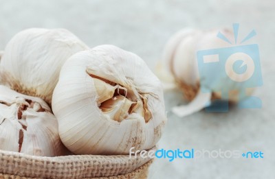 Garlic On Concrete Floor Stock Photo