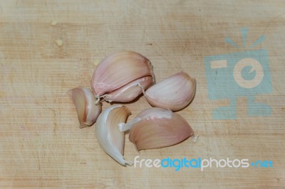 Garlic On Cutting Board Stock Photo