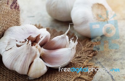 Garlic On Old Floor Stock Photo