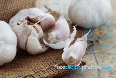 Garlic On Sack Stock Photo