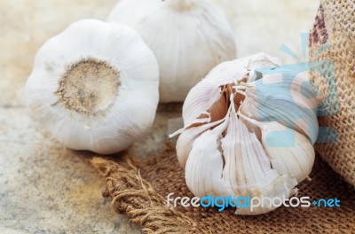 Garlic On Sackcloth Stock Photo