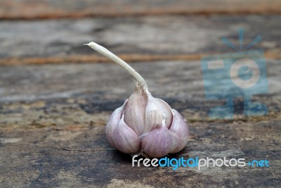 Garlic On The Wooden Background Stock Photo